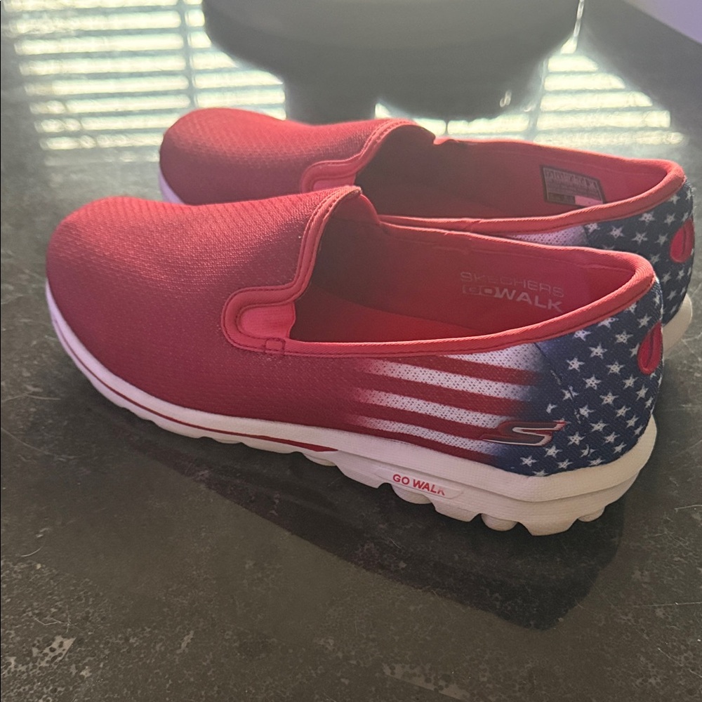 Skechers women’s Go Walk classic slip-on sneakers, featuring RW&B American flag